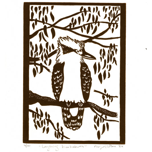 Handprinted linocut print of a laughing kookaburra, vibrant and detailed.