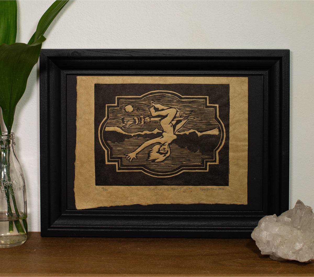 Margarita's First Flight woodcut print framed on a wall