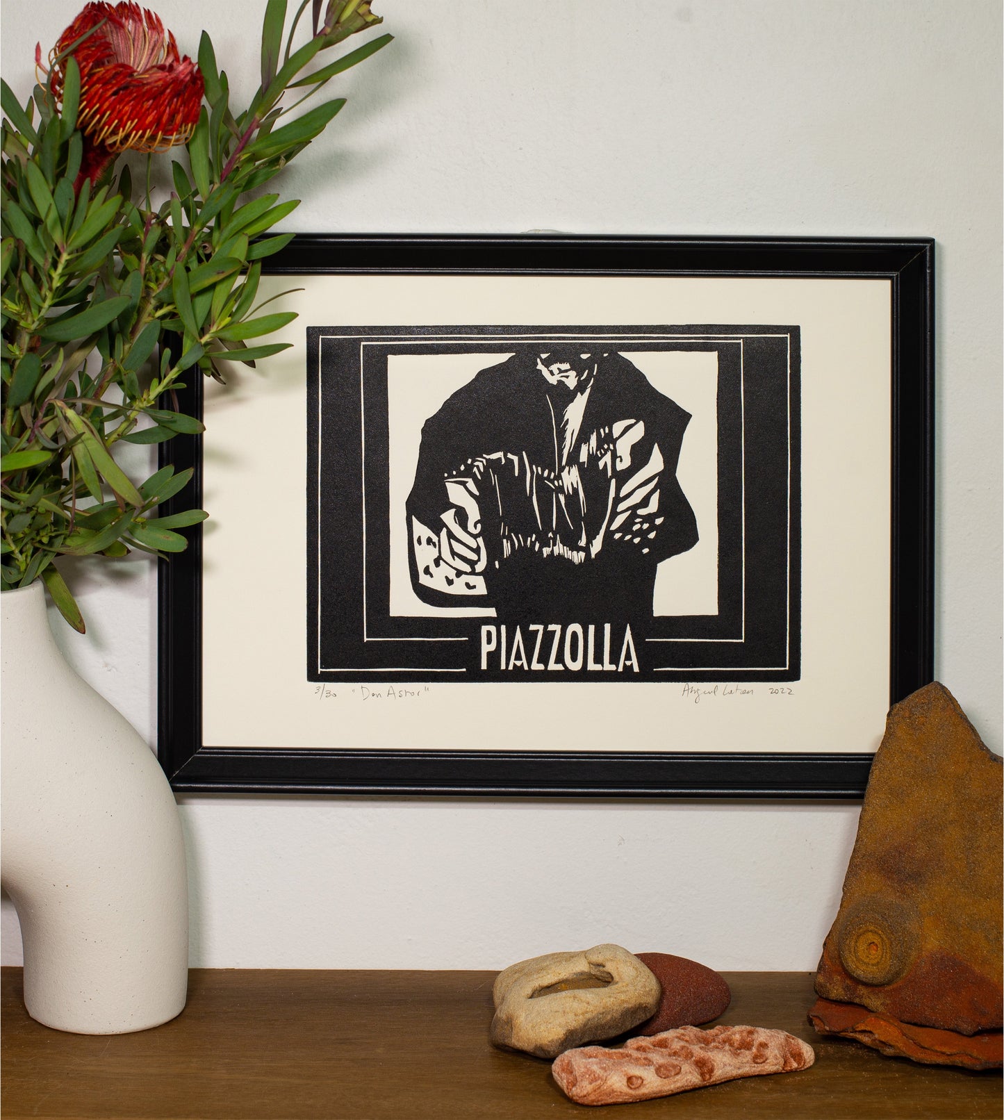 Piazzola linocut print framed on a wall
